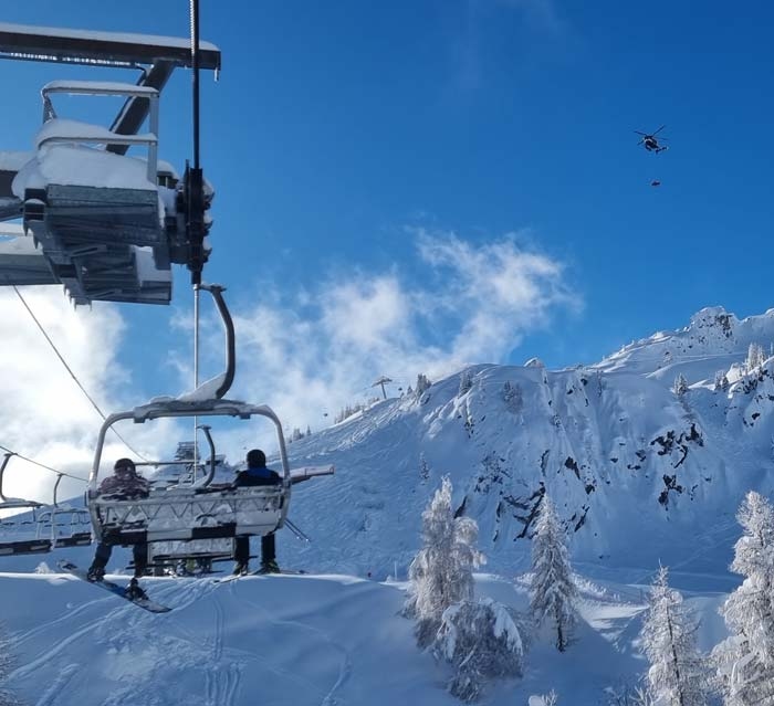 Skiers on a chairlift